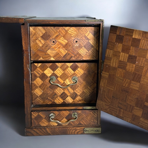 87 - A Japanese Tansu traveling scholar's desk.Meiji period, 19th century.Parquetry design, with twin ped... 