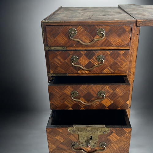 87 - A Japanese Tansu traveling scholar's desk.Meiji period, 19th century.Parquetry design, with twin ped... 