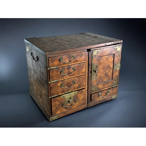 87 - A Japanese Tansu traveling scholar's desk.Meiji period, 19th century.Parquetry design, with twin ped... 