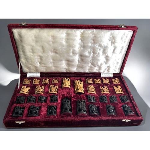 560 - A vintage cased Indian carved wood Ambari Elephant chess set.Ebony & Kadam.