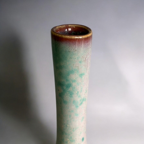 93 - A Chinese Jun 'Peach bloom' glaze porcelain bottle vase.Qing dynasty. Thick Turquoise glaze graduati... 