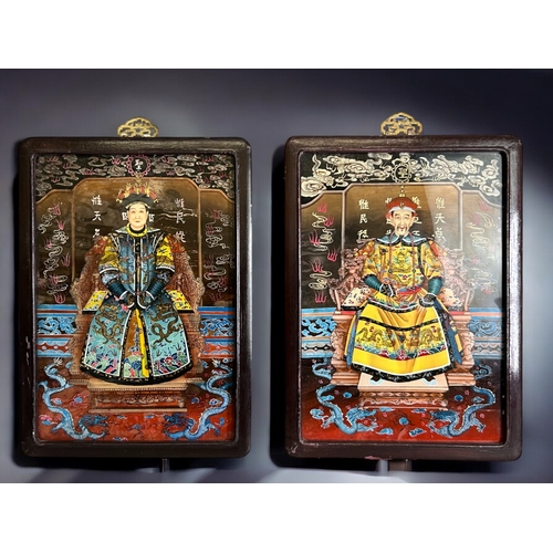 89 - A pair of vintage Chinese reverse painted glass panels. Depicting Emperor / Empress.38 x 27cm