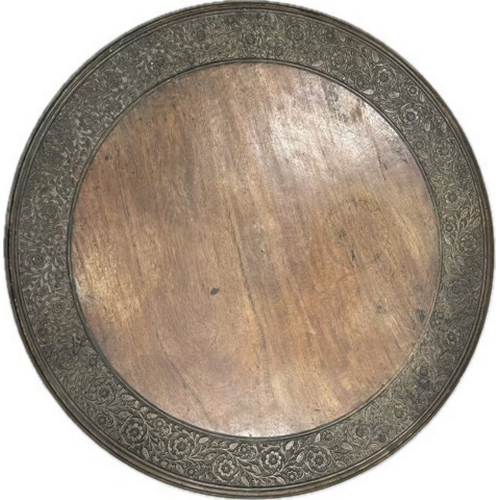 181 - Carved circular wooden table on folding metal detachable legs.