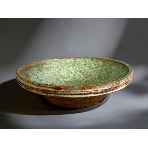 422 - A large Eastern European glazed bowl.