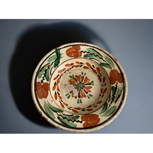 423 - A collection of four Eastern European Folk Art bowls.Various painted scenes.