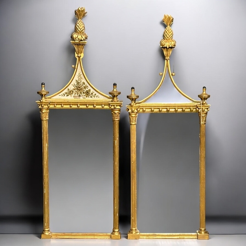 140 - A pair of Giltwood Eglomise Pier mirrors.In the Regency style.Each with Pineapple finials, hung with... 