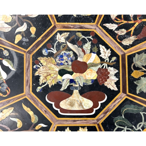 149 - A large Pietra Dura slate table top.Black slate, inlaid with various semi-precious stone. Depicting ... 