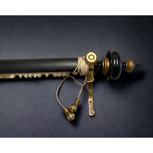 110 - A LARGE GILDED & EBONISED CURTAIN POLE. WITH ADDITIONAL CARVED ENDS.