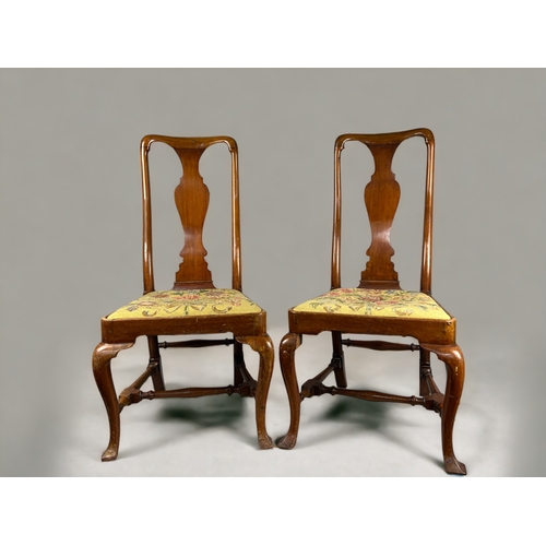 156 - A pair of Queen Anne period Walnut side chairs.With Vasiform back, raised on cabriole legs and turne... 