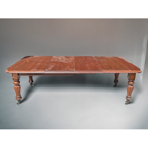 158 - A large Mahogany wind extending dining table.With original leaves. Turned & fluted legs, raised ... 