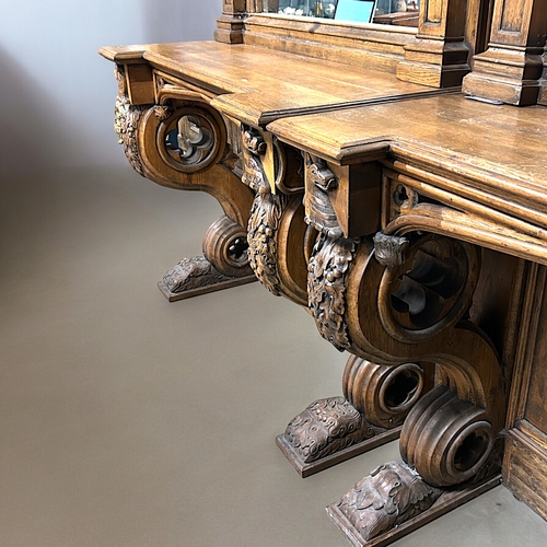 159 - A huge pair of Gothic style carved Oak mirrored console tables. Standing at approximately 10.6ft tal... 