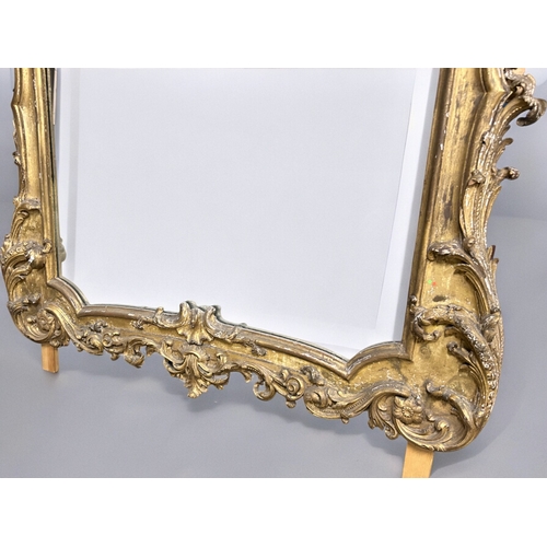 160 - A huge Louis XVI style carved gilt wood mirror.France, 19th century.Stylised scrolling designHeight ... 