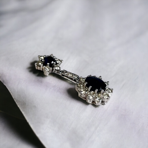 550 - A PAIR OF 18 CARAT WHITE GOLD, DIAMOND & SAPPHIRE DROP EARRINGS. Each set with an Oval & rou... 