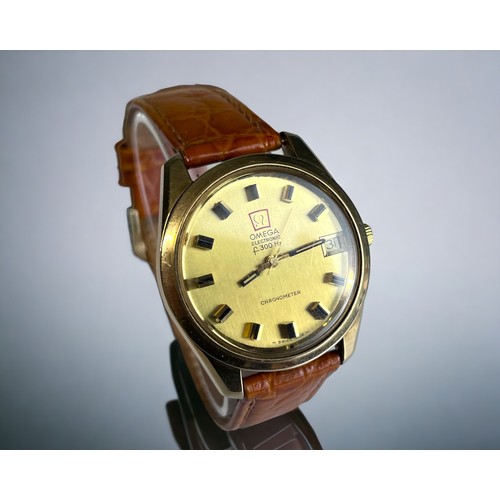 551 - A 1970's OMEGA F300HZ CHRONOMETER MENS WRISTWATCH. Gold case, with polished gold dial and raised bla... 