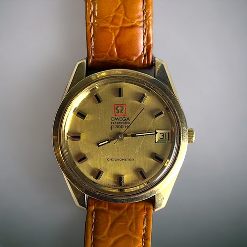 551 - A 1970's OMEGA F300HZ CHRONOMETER MENS WRISTWATCH. Gold case, with polished gold dial and raised bla... 