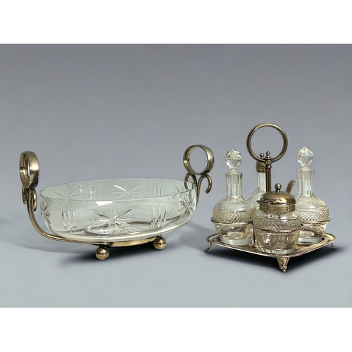 511 - A Victorian silver plate & crystal centrepiece bowl. Together with a four piece cruet set.