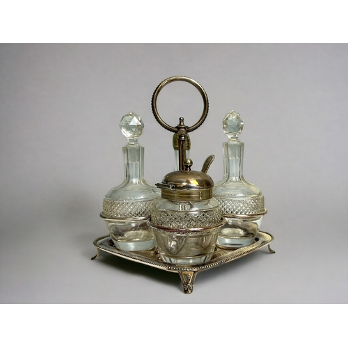 511 - A Victorian silver plate & crystal centrepiece bowl. Together with a four piece cruet set.