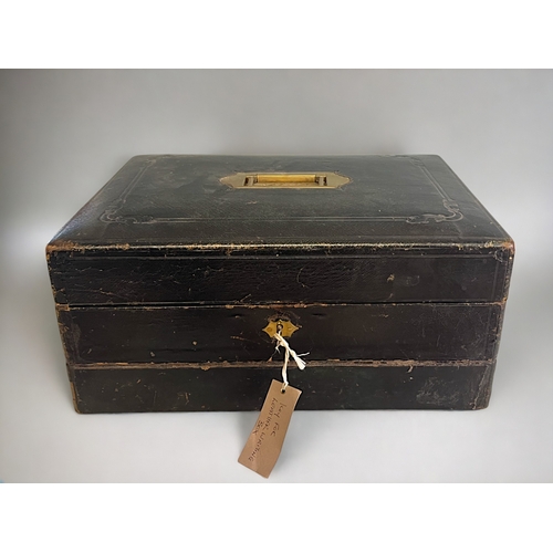 556 - An 1850's leather bound Correspondence / travel box.Lift lid revealing fitted correspondence compart... 