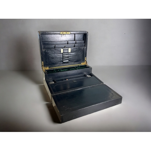 556 - An 1850's leather bound Correspondence / travel box.Lift lid revealing fitted correspondence compart... 