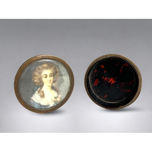 515 - Two 19th century French miniature portraits.One in a repousse sterling silver frame. The other set i... 