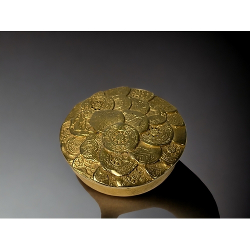 521 - FRENCH DESIGN EDOAURD RAMBAUD GOLD TONE TRINKET BOX. Circa 1980's. Depicting numerous ancient coins ... 