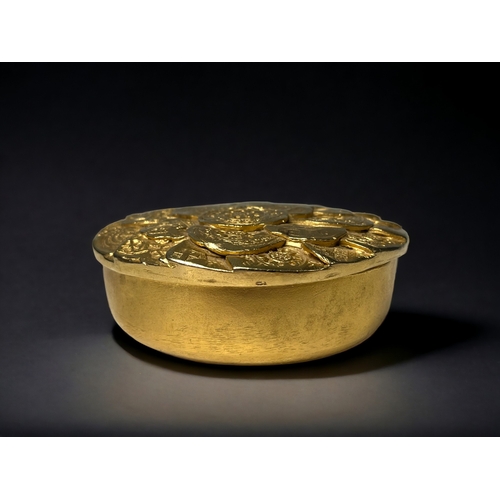 521 - FRENCH DESIGN EDOAURD RAMBAUD GOLD TONE TRINKET BOX. Circa 1980's. Depicting numerous ancient coins ... 