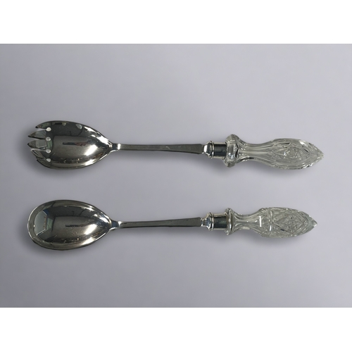 523 - A PAIR OF STERLING SILVER & CUT GLASS SALAD SERVERS. By Frank Cobb & Co, Sheffield. 1910, Sh... 