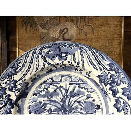 72 - A Large Japanese Arita porcelain charger.Edo period, C1670-1700.Painted in a rich cobalt, depicting ... 