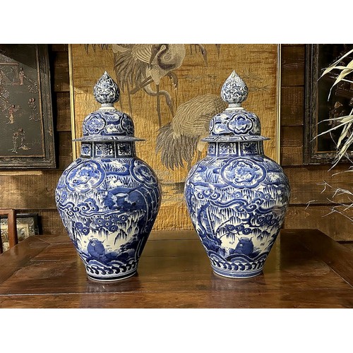 73 - A pair of Large Japanese Arita porcelain vases.Edo period, Circa 1680-1700.Baluster form, with cover... 