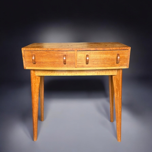 150A - A Mid-century Oak compact console table / desk.Attributed to Morris of Glasgow. H - 80cmW - 76c... 