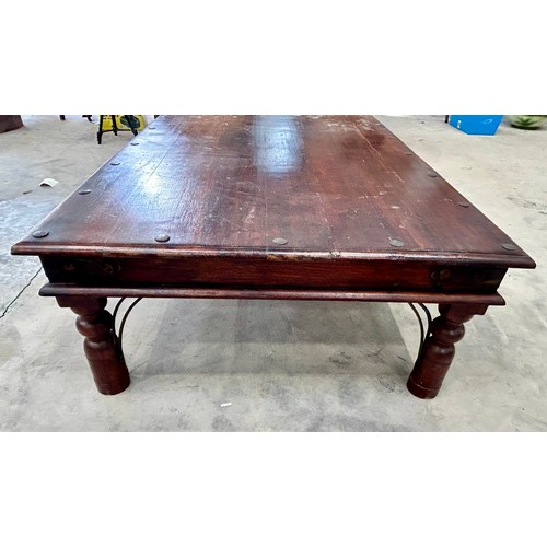 612 - Large metal studded Coffee hardwood table. (height 41cm width 135cm depth 91cm)