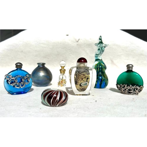 424 - A Chinese Glass Snuff bottle with a Collection of Mdina and other signed paper weights and perfume b... 