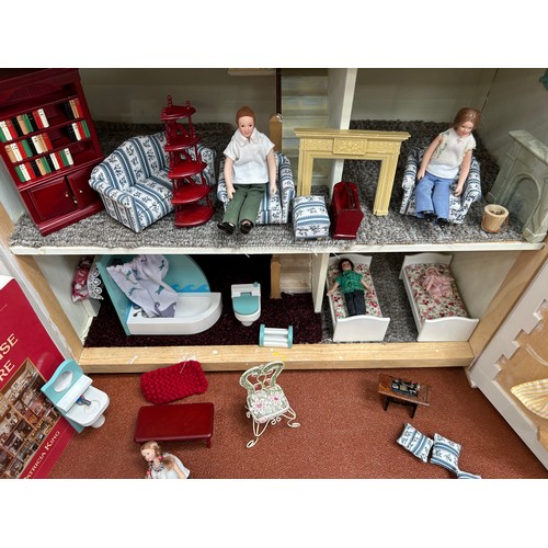 397 - A Large Vintage Doll House and Assorted Doll House Furniture - Good Condition 72cm x63cm x 32cm