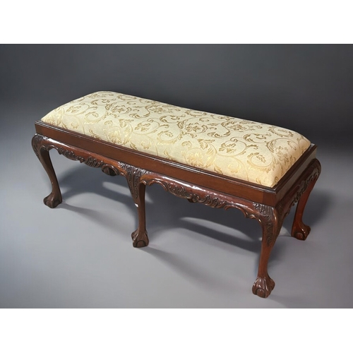 160A - A Chippendale style Mahogany Duet stool /bench.Upholstered seat, with six carved 'Fern' pattern legs... 