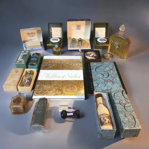 421 - Collection of Vintage Yardley collectibles. To include large sealed perfume bottle, and three other ... 