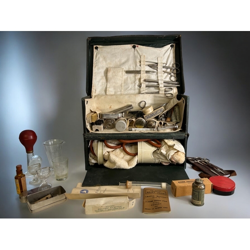 574 - A vintage leather field / Midwifery medical case.Complete with various medical equipment.