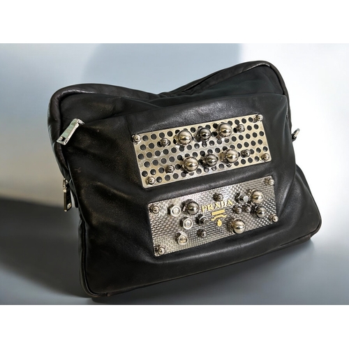 576 - A Prada 'Nuts & Bolts' leather clutch bag.H 12