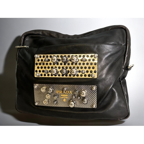 576 - A Prada 'Nuts & Bolts' leather clutch bag.H 12