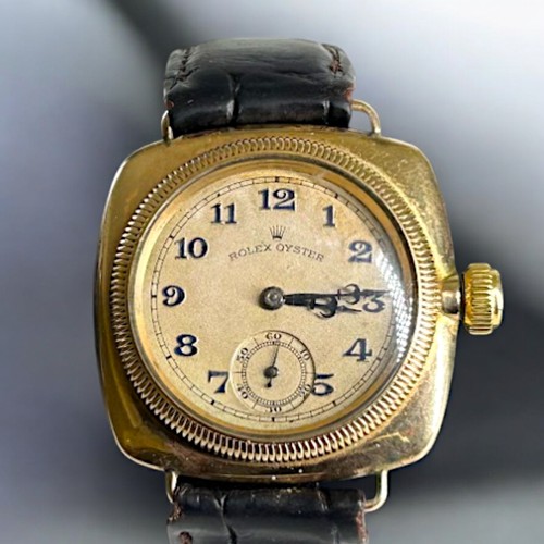 505A - 1920's 9carat gold Rolex Oyster Cushion wind wristwatch.Black roman numerals. Blue / black steel han... 