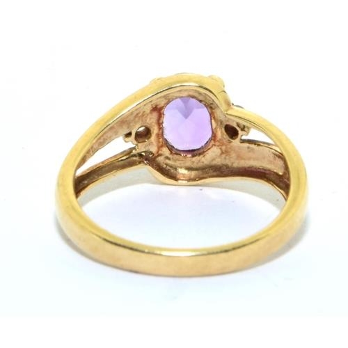 44 - 9ct gold ladies Amethyst and Diamond twist shank  ring 3.2g size N