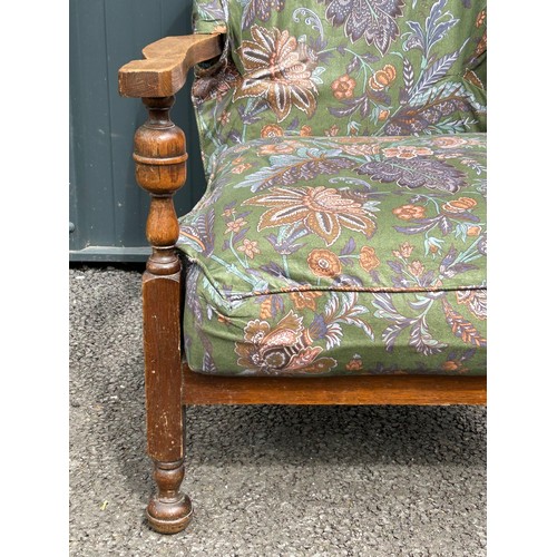 490 - Early 20th century upholstered oak armchair with sprung seat, hand sawn velcroed cover