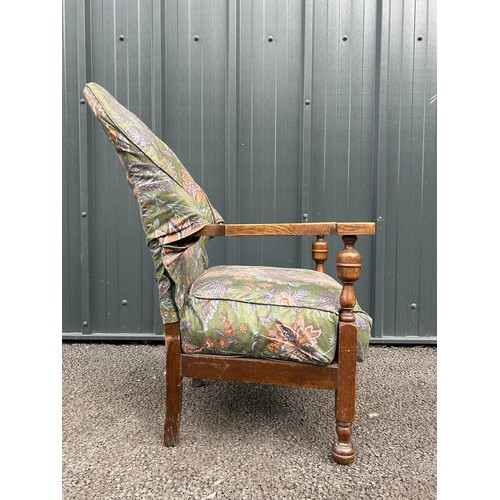 490 - Early 20th century upholstered oak armchair with sprung seat, hand sawn velcroed cover