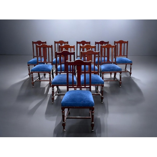 140A - A scarce run of 12 upholstered Mahogany dining chairs.Slatted backs, with stretchers and turned legs... 