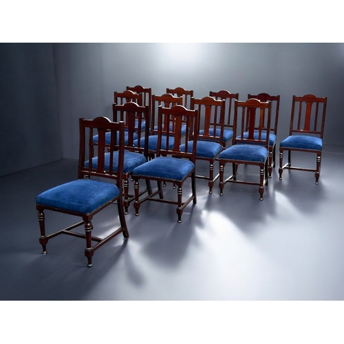 140A - A scarce run of 12 upholstered Mahogany dining chairs.Slatted backs, with stretchers and turned legs... 