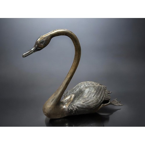 162A - A large Pair of bronze garden Swans.Largest - 60 x 63cm