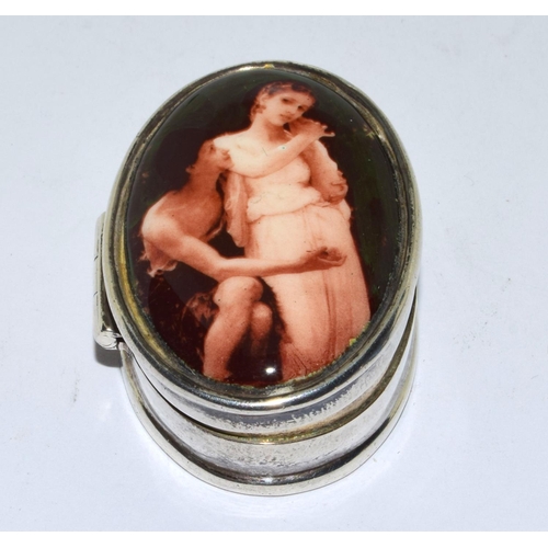 207 - Silver enamel oval pill box with an erotic front design together a silver vesta case