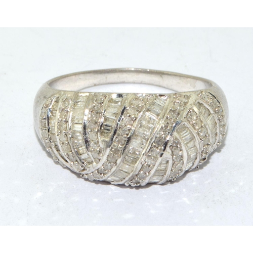 227 - 925 silver ladies vintage bulbous wave ring with baguette and round cut decoration size T