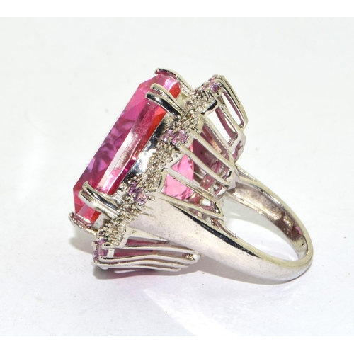 60 - Huge ladies statement or cocktail ring featuring a centre pink tourmaline coloured main stone surrou... 