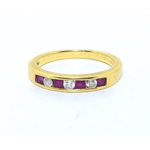 273 - 18ct gold ladies Diamond and Ruby channel set 1/2 eternity ring size L