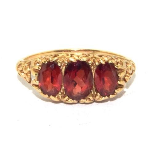 275 - 9ct gold vintage Garnet 3 stone ring in a scroll work setting size P